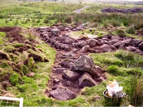 2016. Foundations of a medieval cruck-framed building after stripping topsoil, Touch Estate.